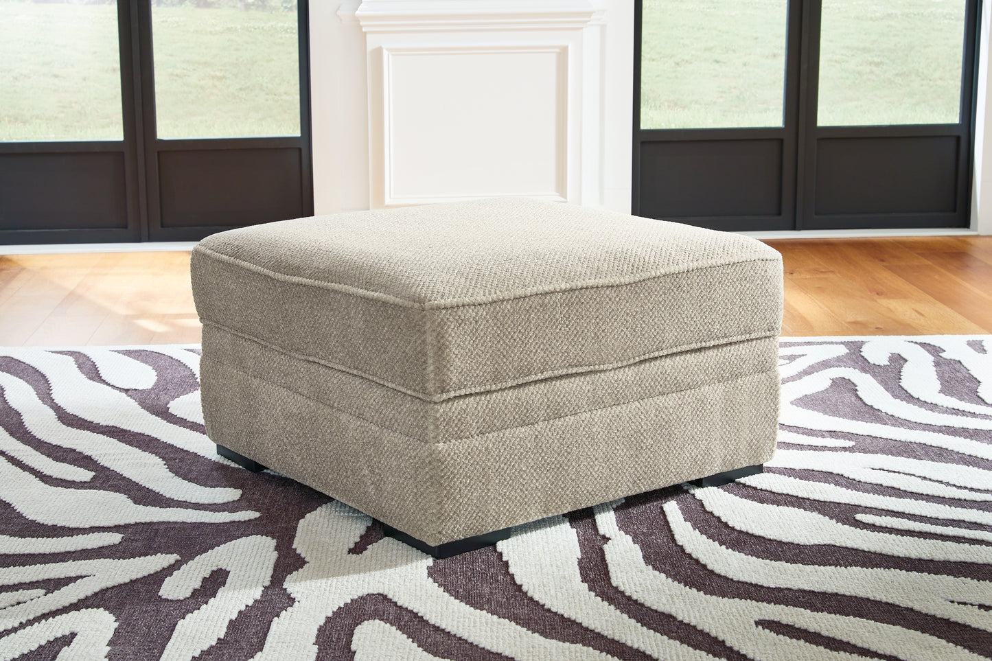 The Furniture Outlets - Ashley Furniture - Calnita Living Room - Ottoman With Storage / Sisal - 2050211