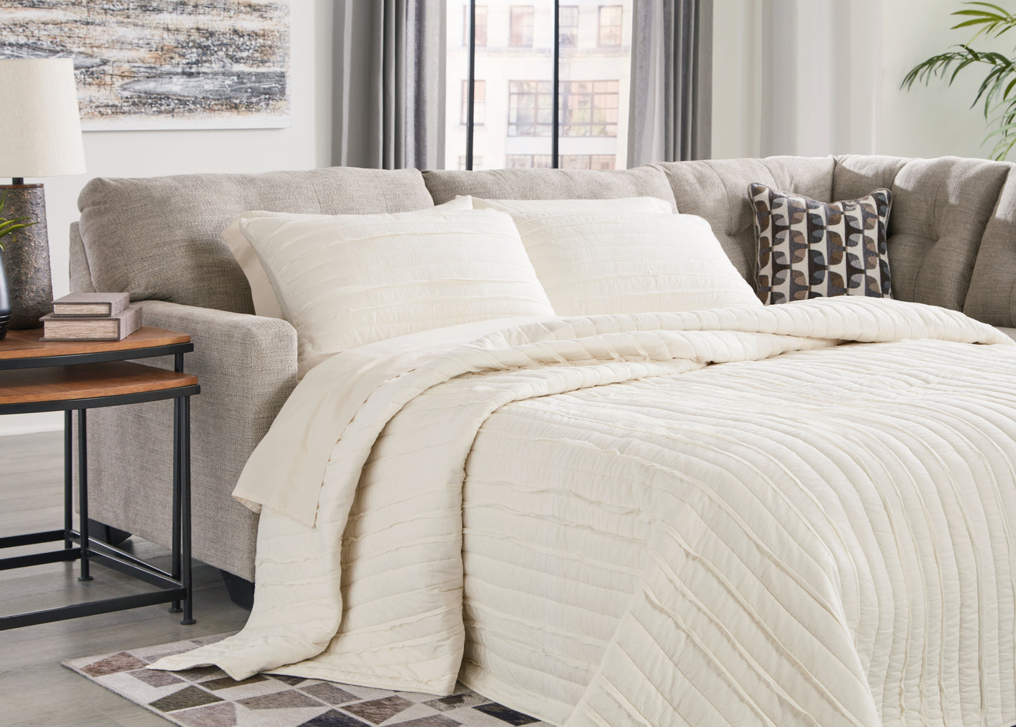 The Furniture Outlets - Ashley Furniture - Mahoney Sectional - 2-Piece Sleeper Sectional with Chaise / Pebble - 31004S4