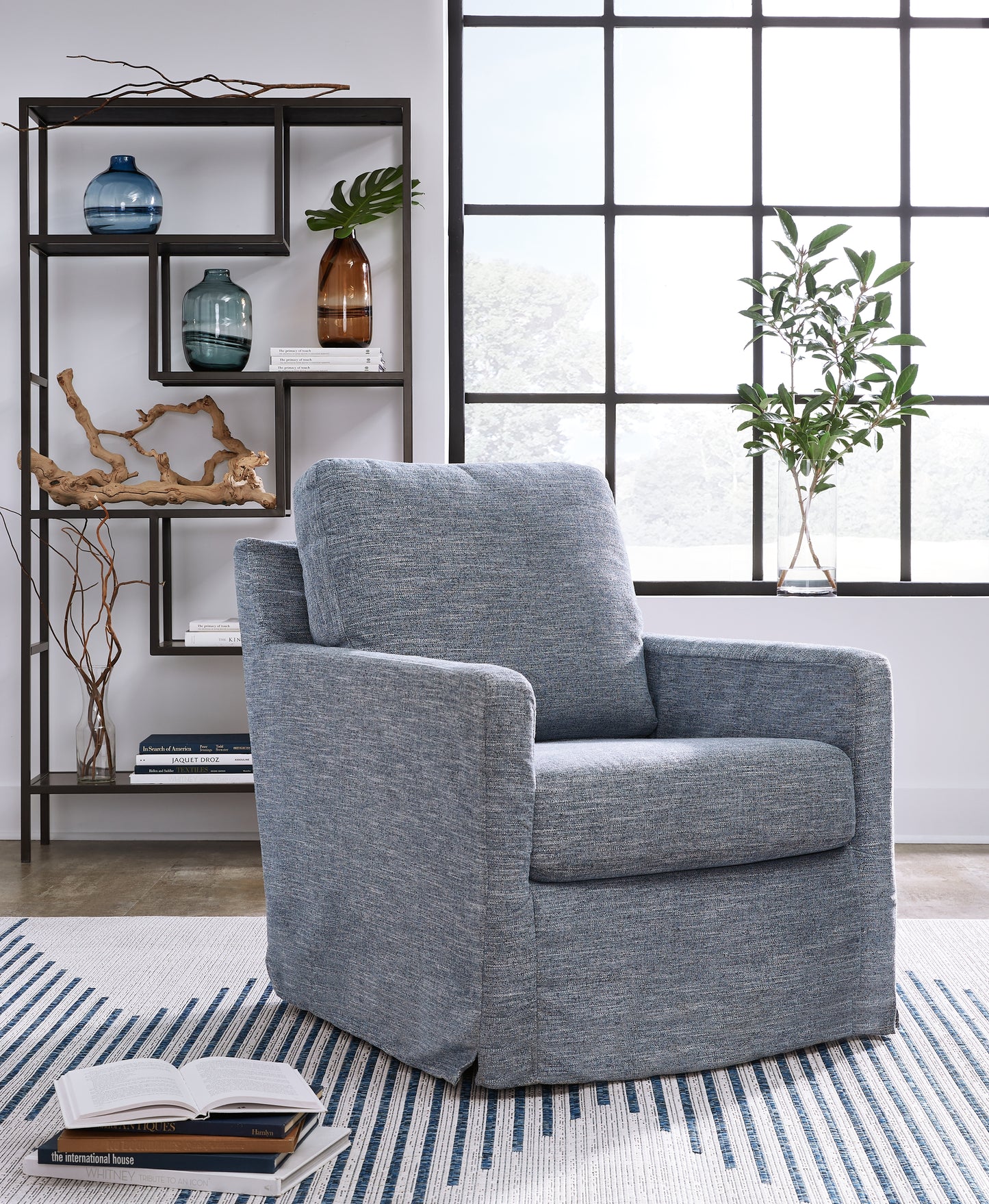 The Furniture Outlets - Ashley Furniture - Nenana Next-Gen Nuvella Swivel Glider Accent Chair - Swivel Glider Accent Chair / Denim - A3000646