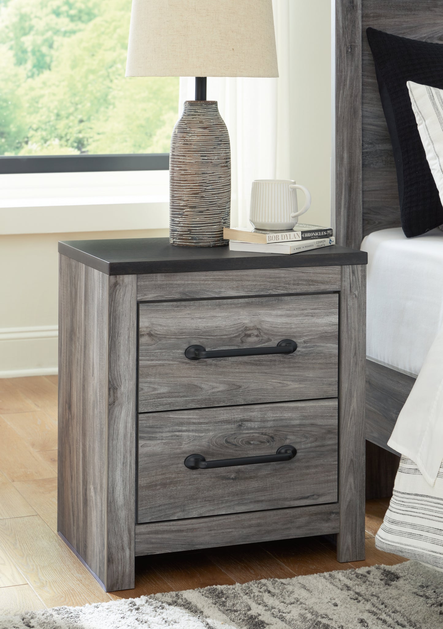 The Furniture Outlets - Ashley Furniture - Bronyan Bedroom - Two Drawer Night Stand / Dark Gray - B1290-92