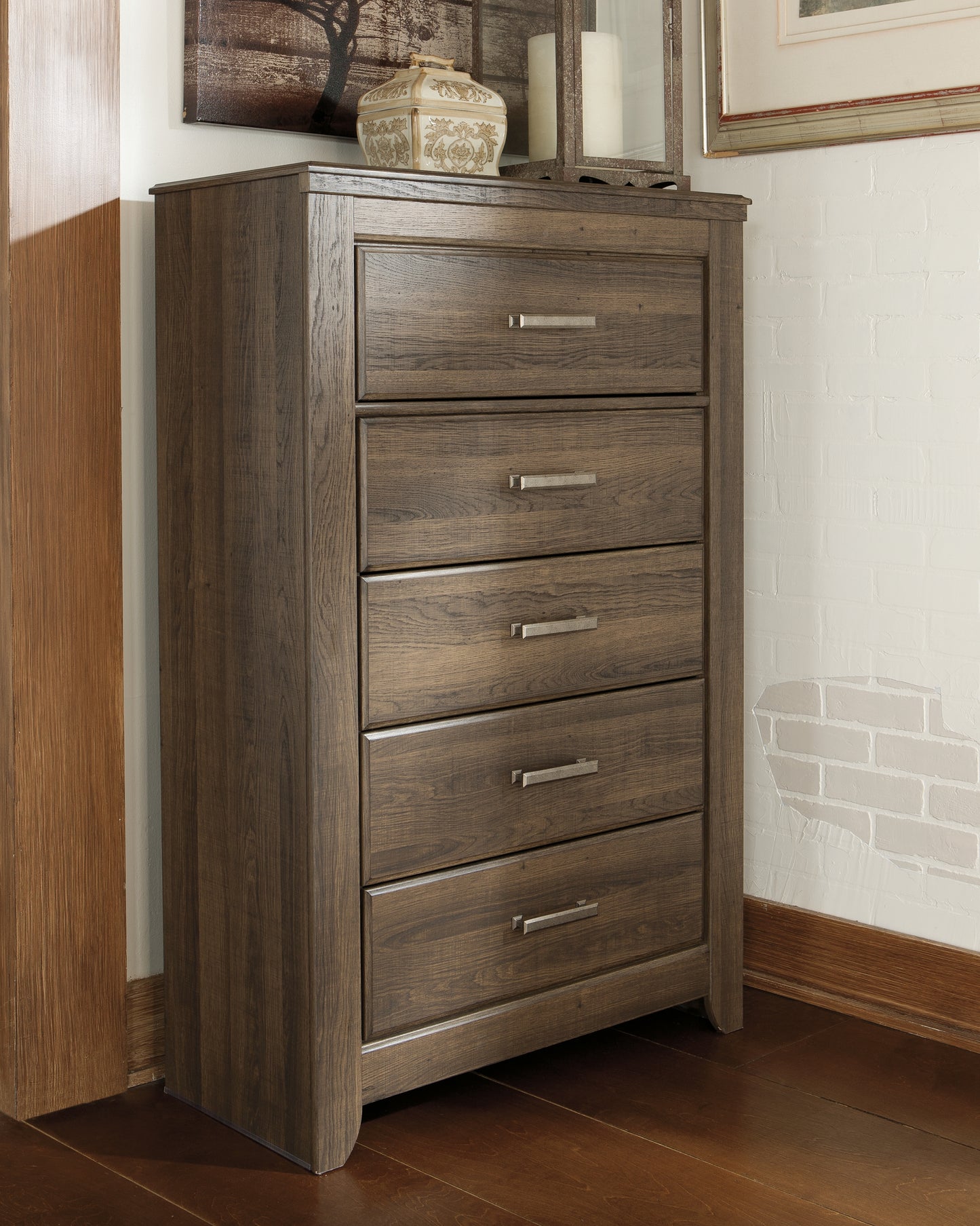 The Furniture Outlets - Ashley Furniture - Juararo Bedroom - Five Drawer Chest / Dark Brown - B251-46