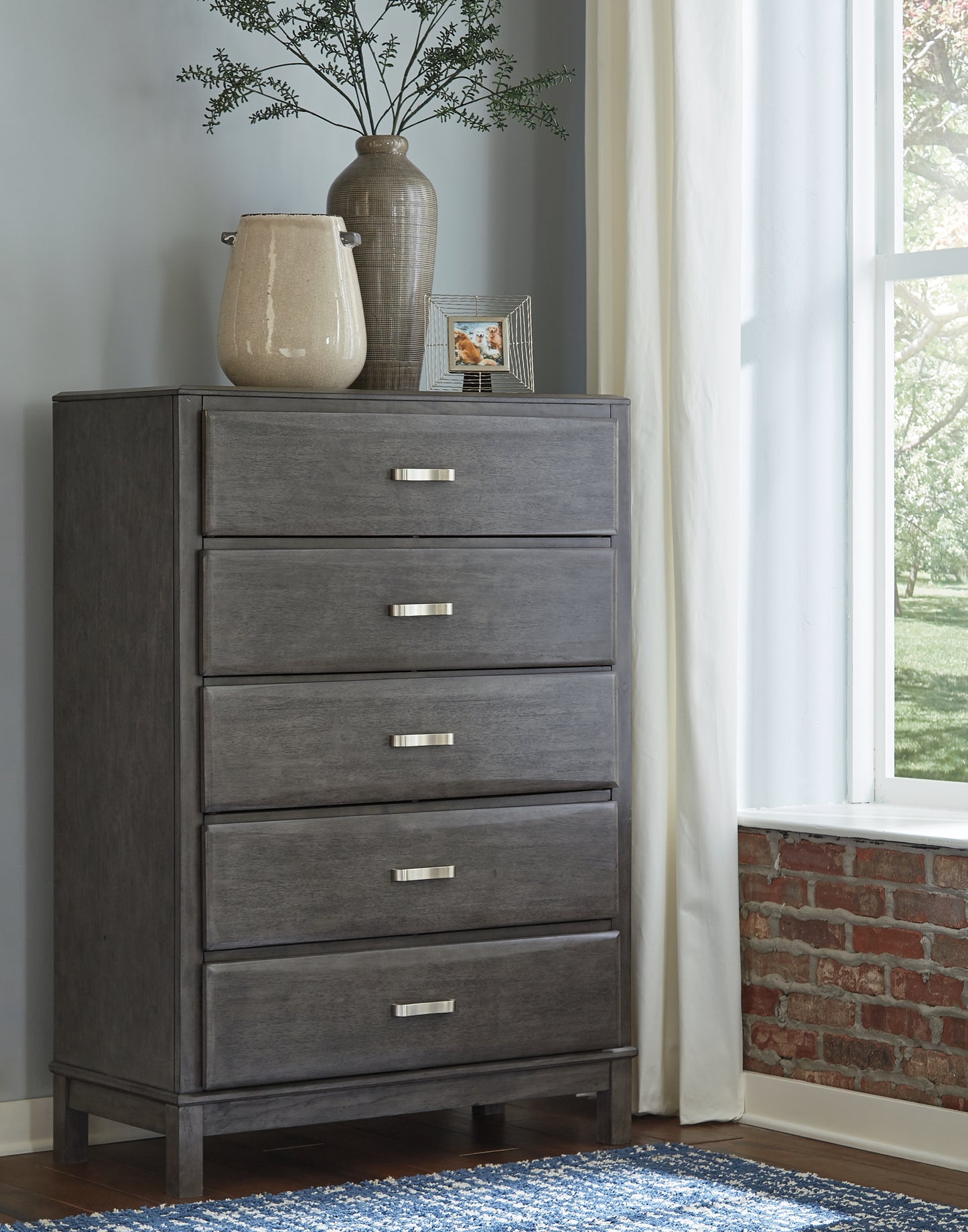 The Furniture Outlets - Ashley Furniture - Caitbrook Bedroom - Five Drawer Chest / Gray - B476-46