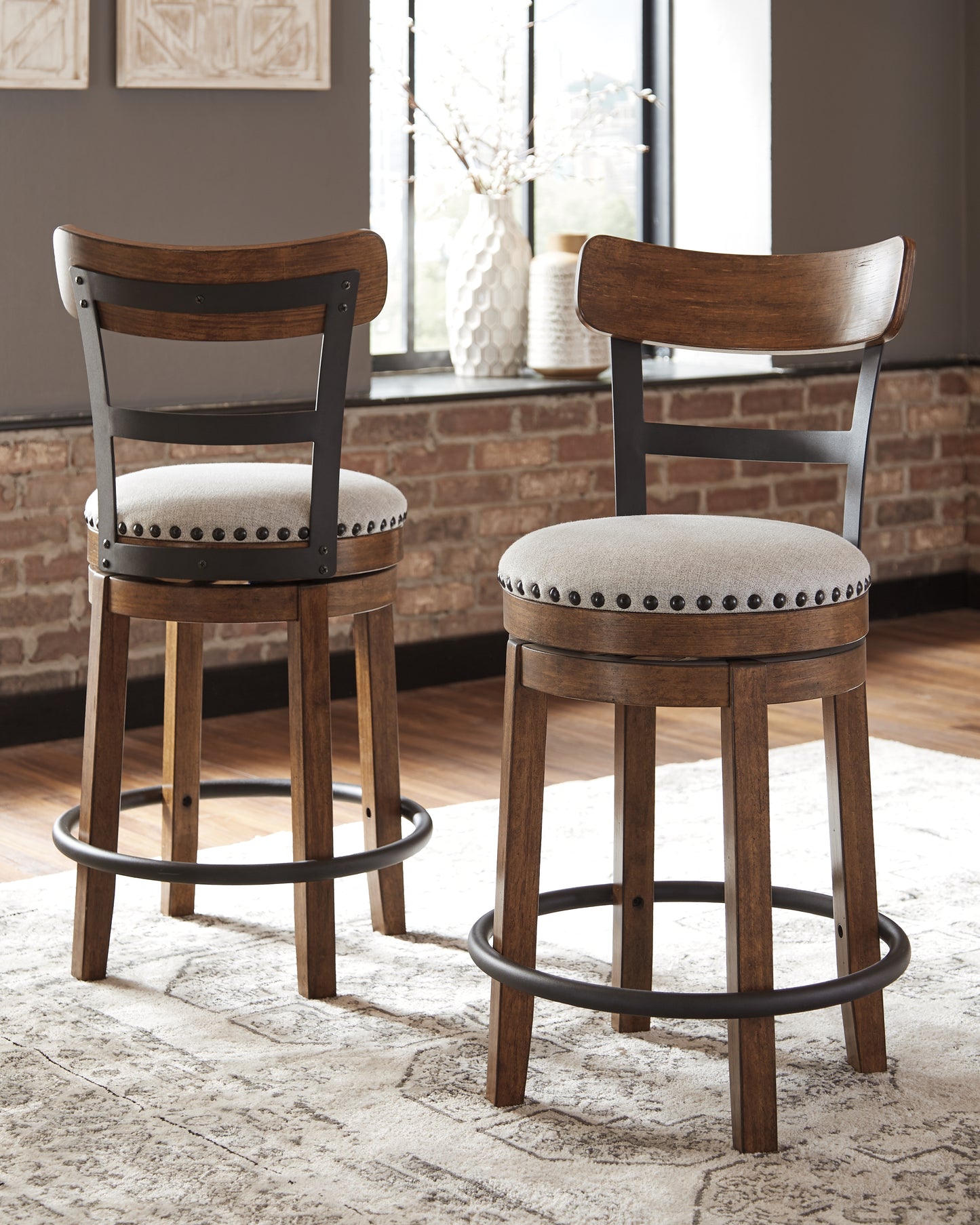 The Furniture Outlets - Ashley Furniture - Valebeck Dining Room - UPH Swivel Barstool (1/CN) / Brown - D546-424