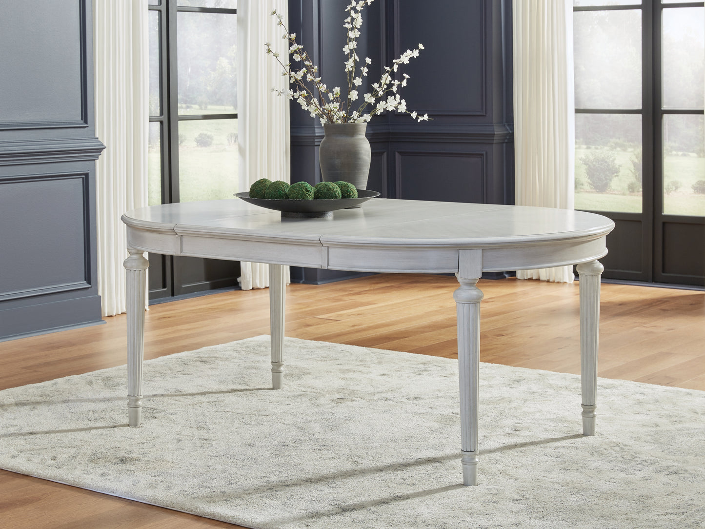 The Furniture Outlets - Ashley Furniture - Montelaine Dining Room - Oval Dining Room EXT Table / Antique White - D795-35