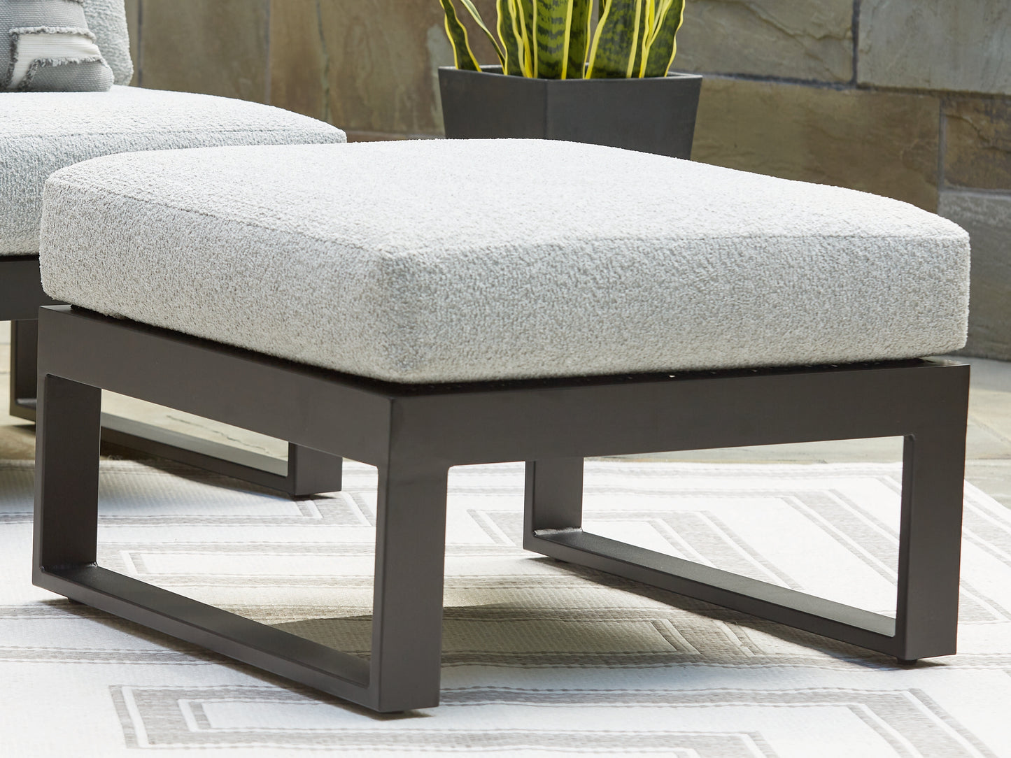 The Furniture Outlets - Ashley Furniture - Beachloft Outdoor - Ottoman with Cushion / Black/Gray - P490-814