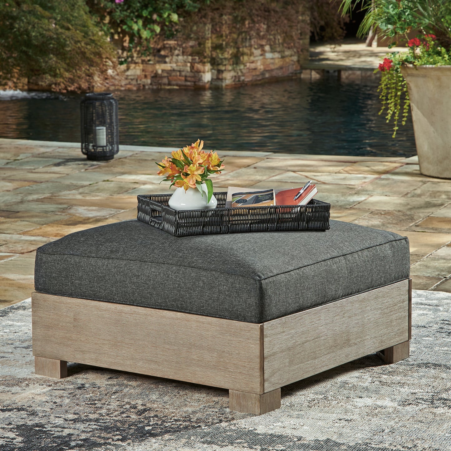 The Furniture Outlets - Ashley Furniture - Citrine Park Outdoor - Ottoman with Cushion / Brown/Charcoal - P660-814