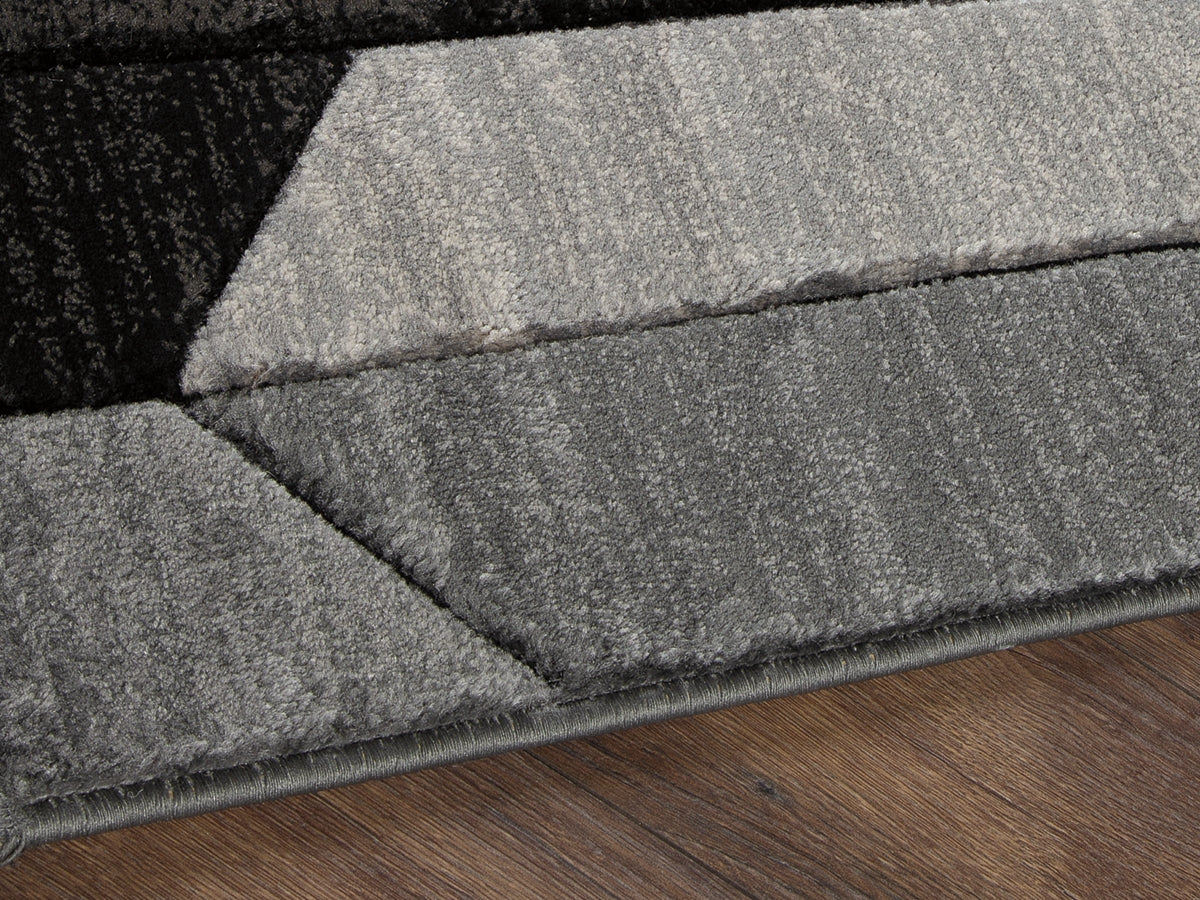 The Furniture Outlets - Ashley Furniture - Chayse Rug - 6'6" x 9'6" Rug / Black/Gray - R403461