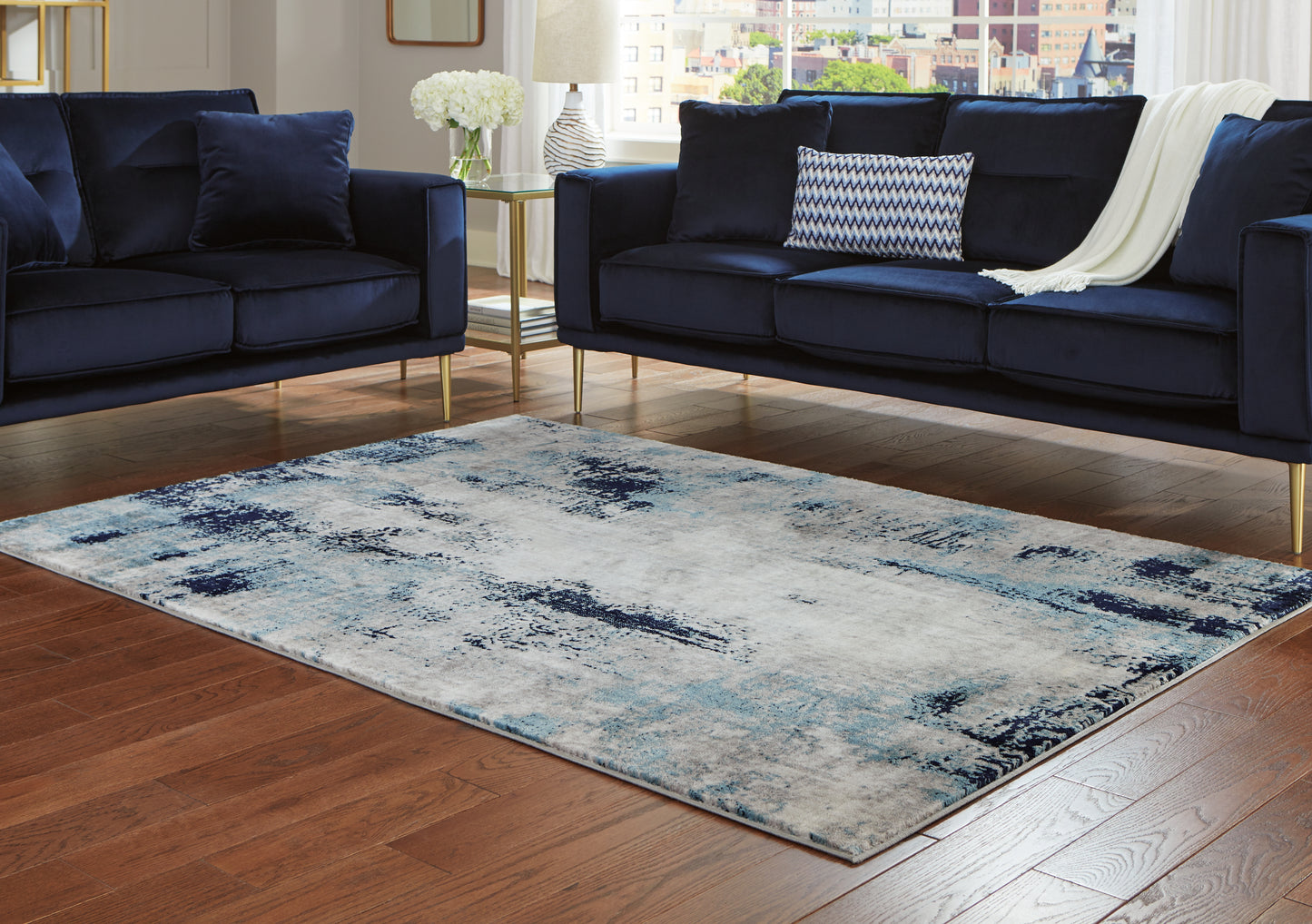 The Furniture Outlets - Ashley Furniture - Leonelle Rug - 7'10" x 10' Rug / White/Blue/Gray - R404871
