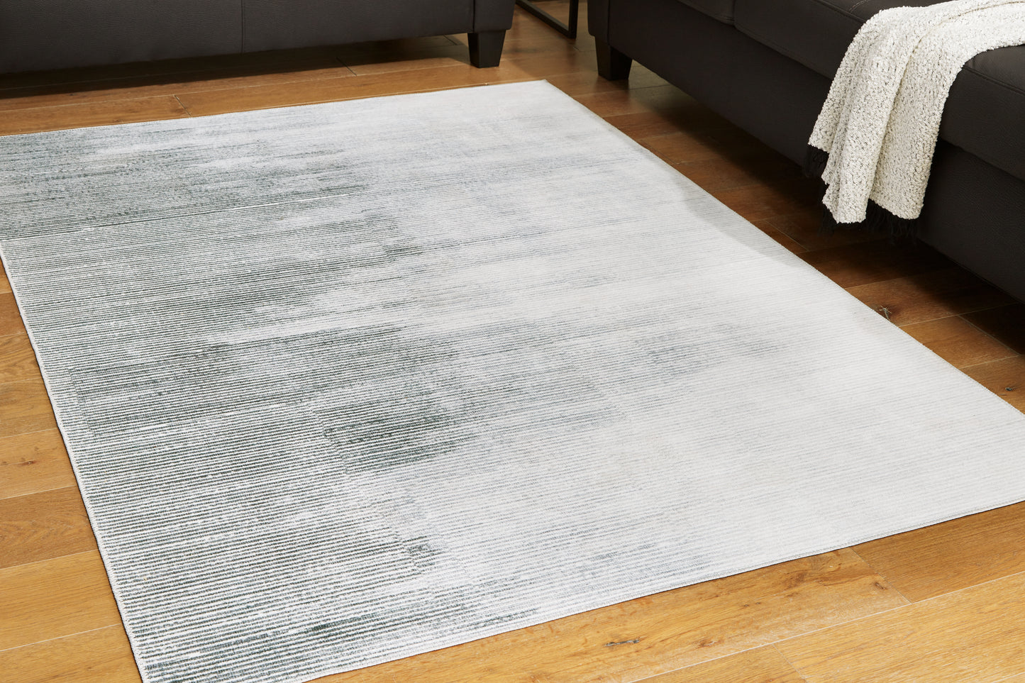 The Furniture Outlets - Ashley Furniture - Milset Rug - 8'1" x 10' Washable Rug / Black/White/Gray - R406251