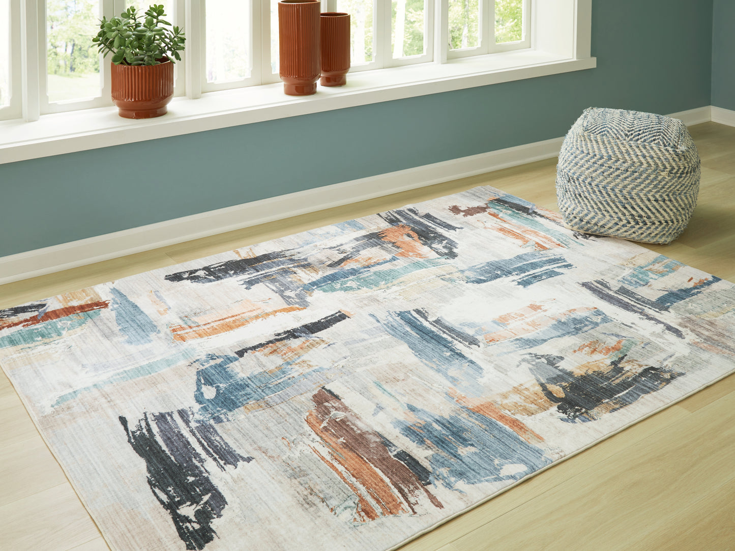 The Furniture Outlets - Ashley Furniture - Hessland Rug - 8' x 10' Washable Rug / Multi - R407051