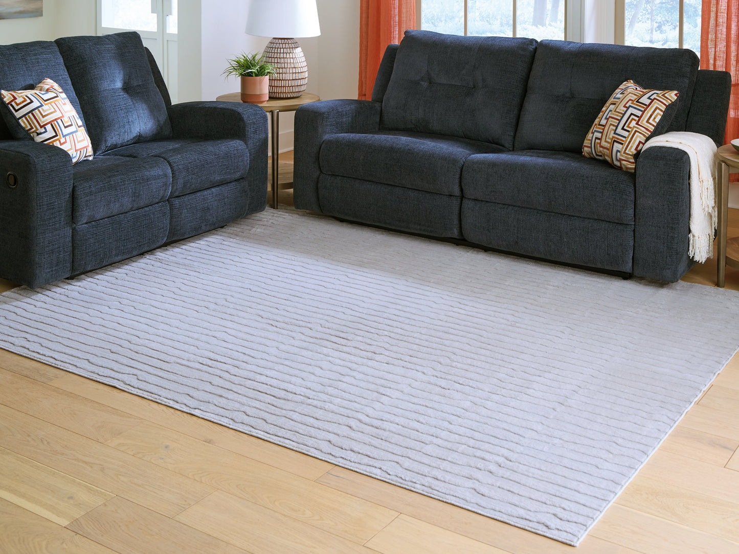 The Furniture Outlets - Ashley Furniture - Worthley Rug - Washable 5' x 7' Area Rug / Gray - R407452