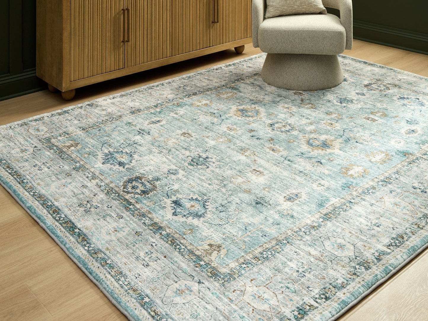 The Furniture Outlets - Ashley Furniture - Ladstoney Rug - 5' x 7' Area Rug / Teal/Beige/Ochre - R407502