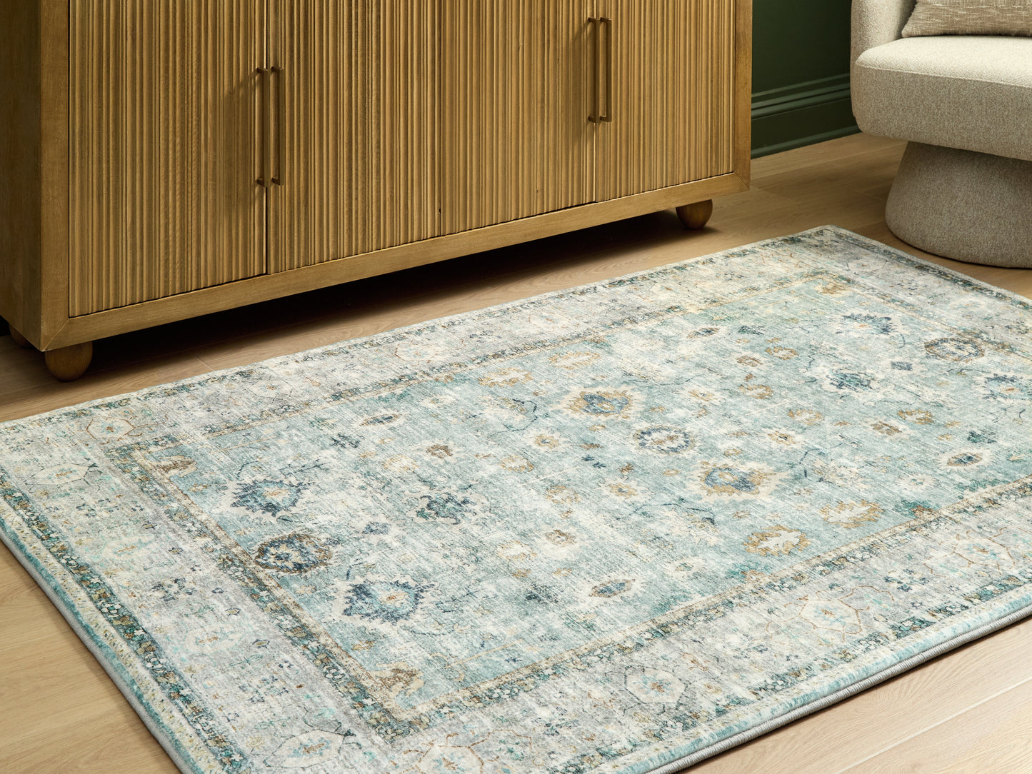 The Furniture Outlets - Ashley Furniture - Ladstoney Rug - 5' x 7' Area Rug / Teal/Beige/Ochre - R407502
