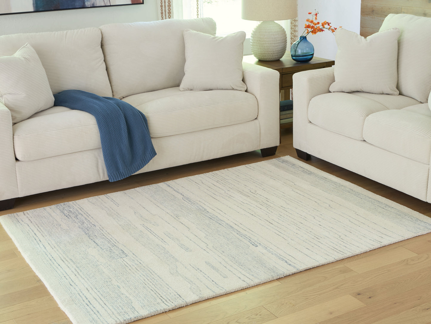 The Furniture Outlets - Ashley Furniture - Genemost Rug - 5' x 7' Area Rug / Ivory/Blue - R407842
