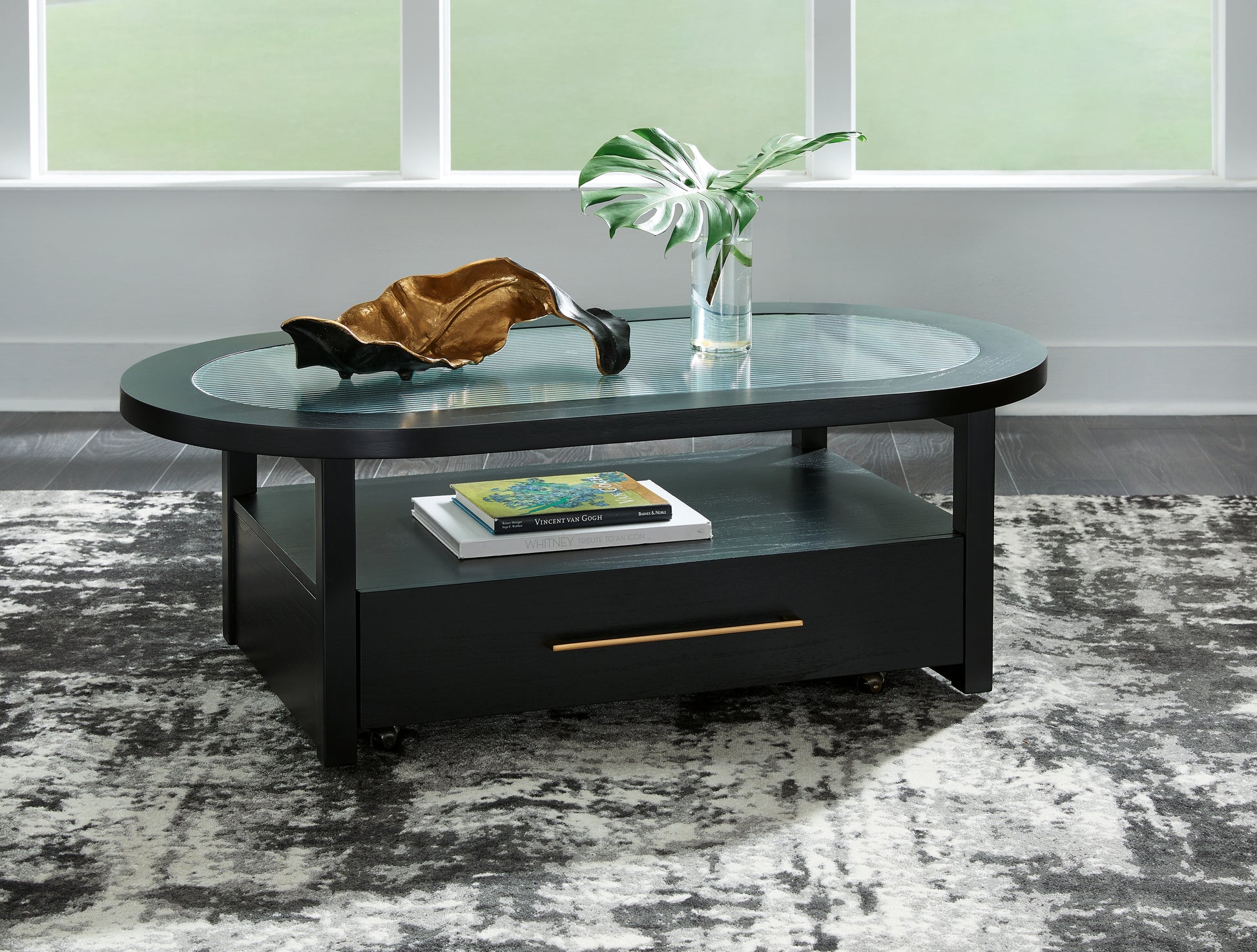 The Furniture Outlets - Ashley Furniture - Winbardi Coffee Table - Oval Cocktail Table / Black - T786-0