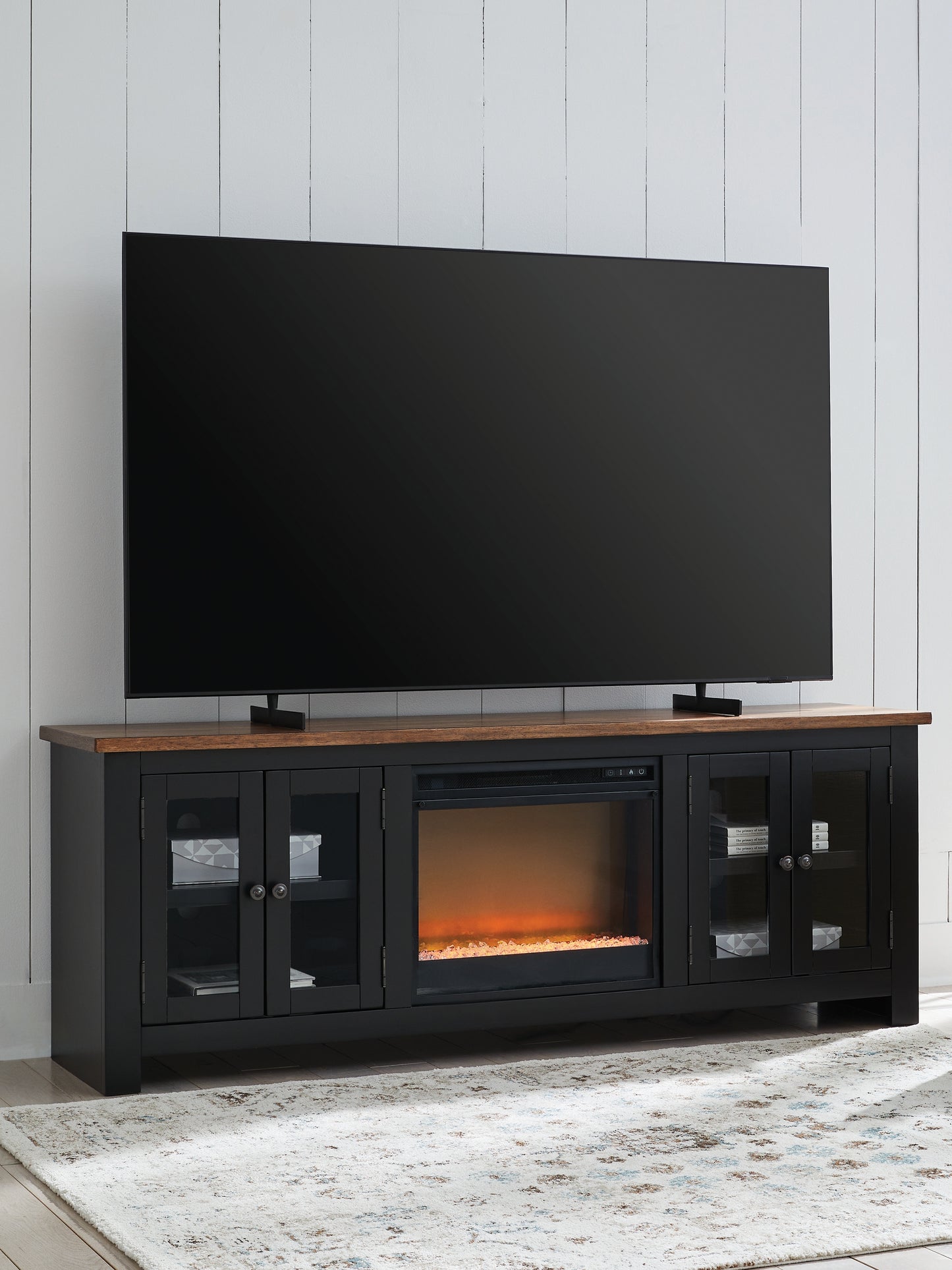 The Furniture Outlets - Ashley Furniture - Wildenauer 76" TV Stand with Electric Fireplace - 76" TV Stand with Electric Fireplace / Brown/Black - W664W2