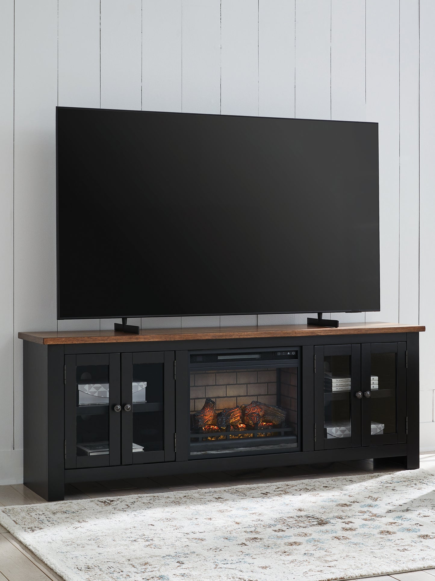 The Furniture Outlets - Ashley Furniture - Wildenauer 76" TV Stand with Electric Fireplace - 76" TV Stand with Electric Fireplace / Brown/Black - W664W1