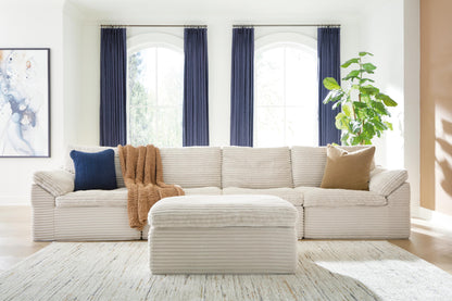 The Furniture Outlets - Ashley Furniture - Fannin Sectional - RAF 4-Piece Sectional with Ottoman / Ivory - PC84304S1