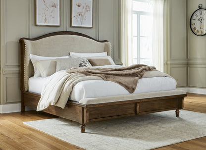 The Furniture Outlets - Ashley Furniture - Sturlayne Bedroom - California King Upholstered Panel Bed / Brown - B787B5