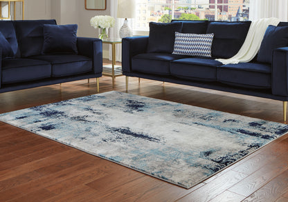 The Furniture Outlets - Ashley Furniture - Leonelle Rug - 7'10" x 10' Rug / White/Blue/Gray - R404871