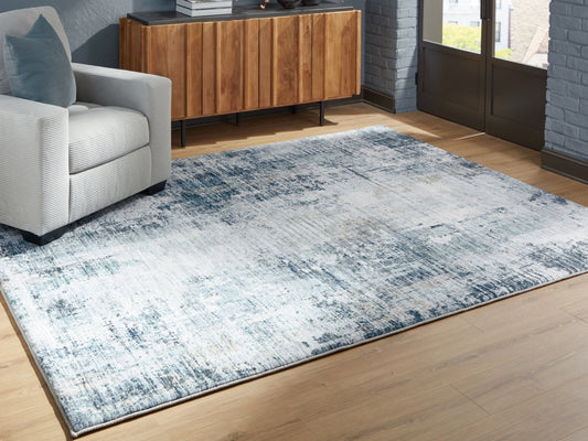 The Furniture Outlets - Ashley Furniture - Arlenmont Rug - 7'6" x 9'6" Area Rug / Blue/White/Brown - R407481