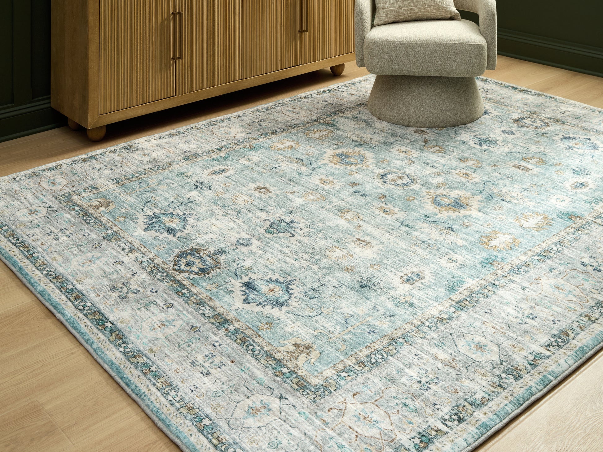 The Furniture Outlets - Ashley Furniture - Ladstoney Rug - 5' x 7' Area Rug / Teal/Beige/Ochre - R407502