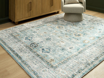The Furniture Outlets - Ashley Furniture - Ladstoney Rug - 5' x 7' Area Rug / Teal/Beige/Ochre - R407502