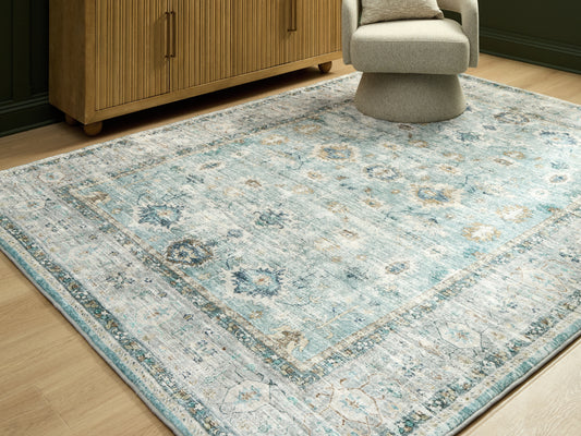 The Furniture Outlets - Ashley Furniture - Ladstoney Rug - 5' x 7' Area Rug / Teal/Beige/Ochre - R407502