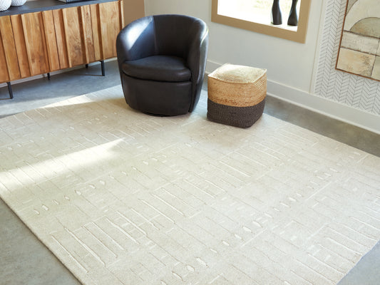 The Furniture Outlets - Ashley Furniture - Wolbert Rug - 5' x 7' Area Rug / Tan/Ivory - R407662
