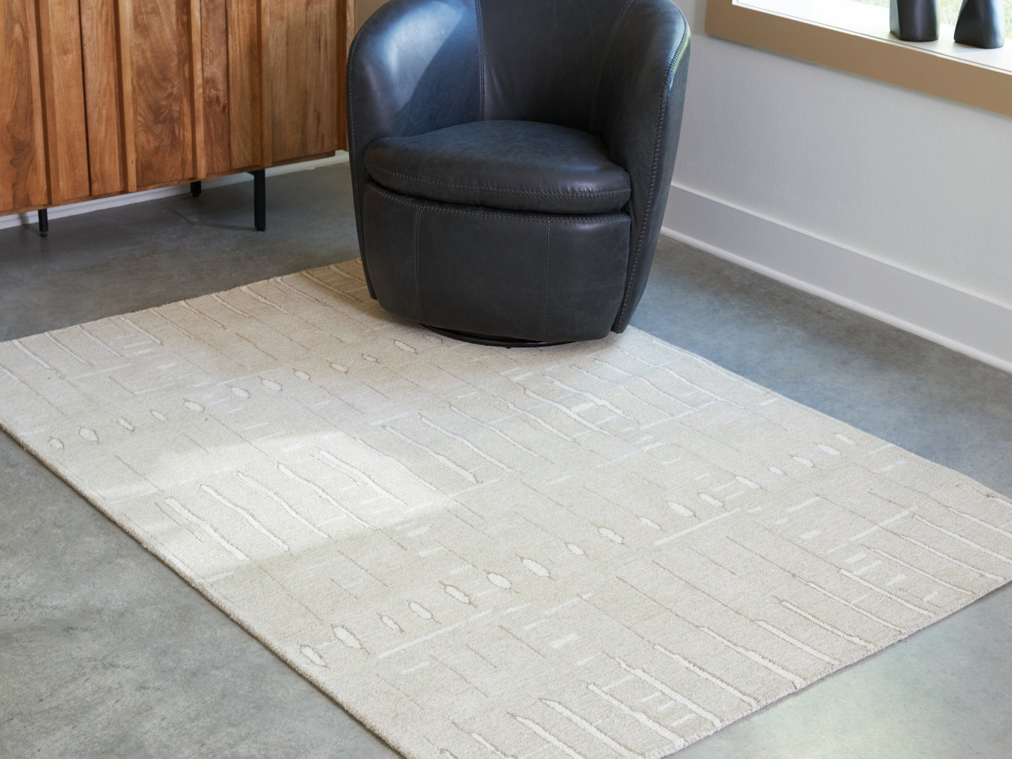 The Furniture Outlets - Ashley Furniture - Wolbert Rug - 5' x 7' Area Rug / Tan/Ivory - R407662